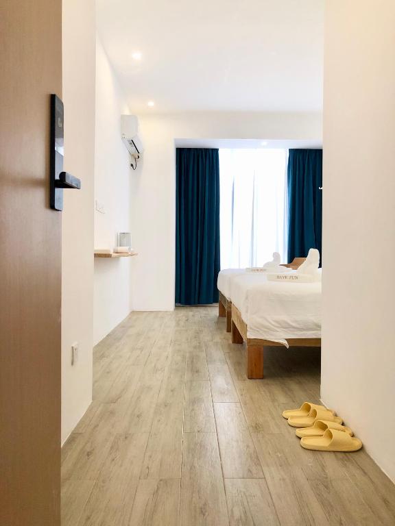 Postel nebo postele na pokoji v ubytování Fun Hotel