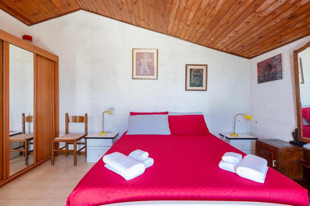Postel nebo postele na pokoji v ubytování La Caletta di Afrodite
