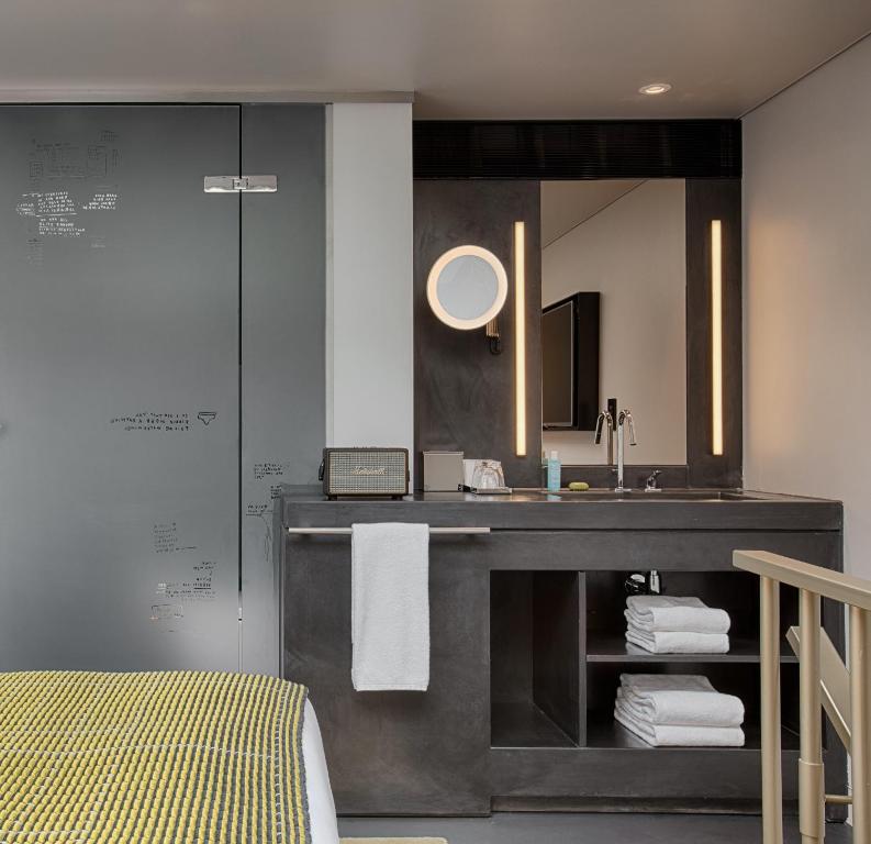 a bathroom with a sink and a mirror at W Amsterdam in Amsterdam