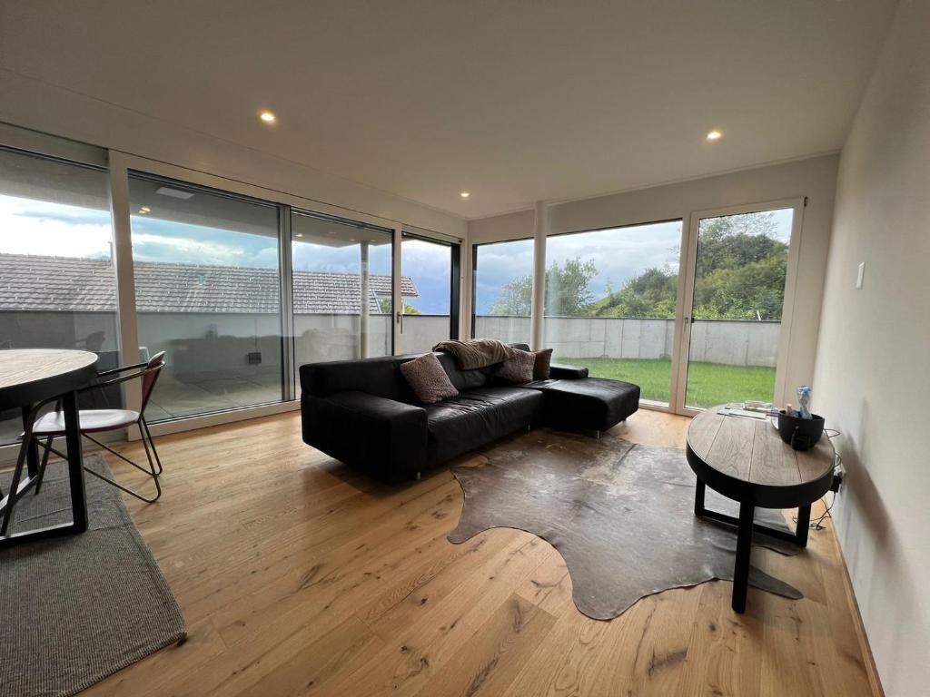 a living room with a couch and a table at Triesenberg in Triesenberg