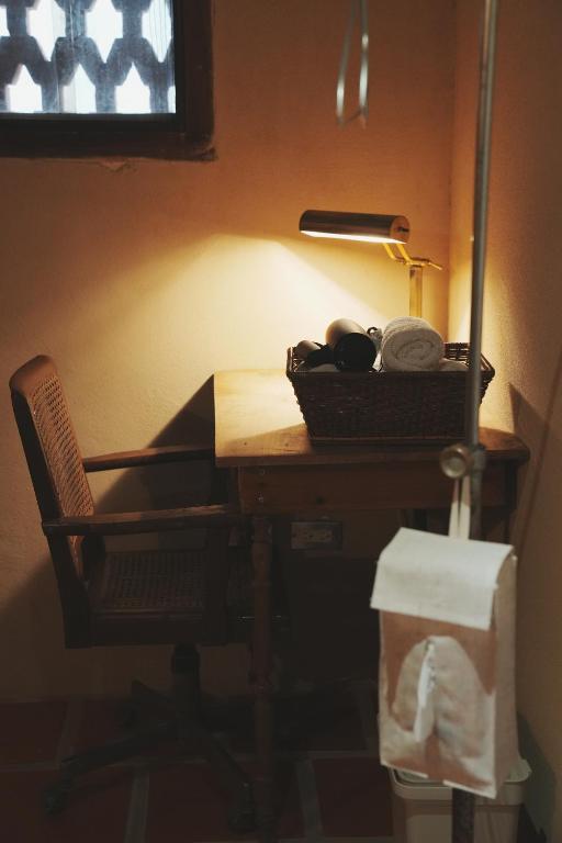 a desk with a chair and a basket on it at 序室 Narrative in Jinhu