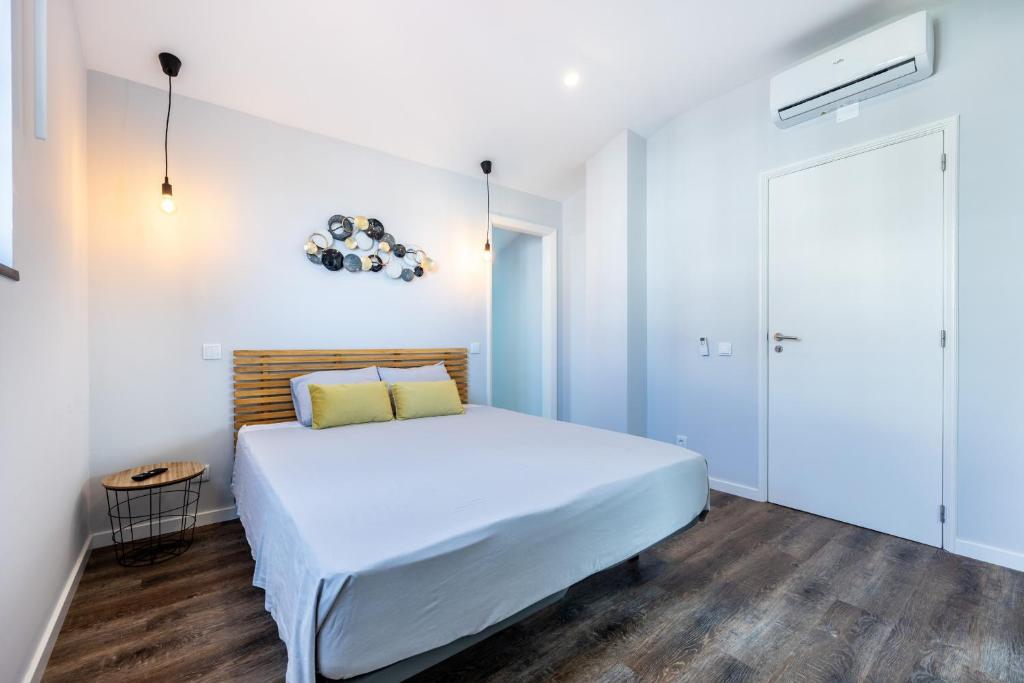 Postel nebo postele na pokoji v ubytování Angra Charming Suites by Seewest