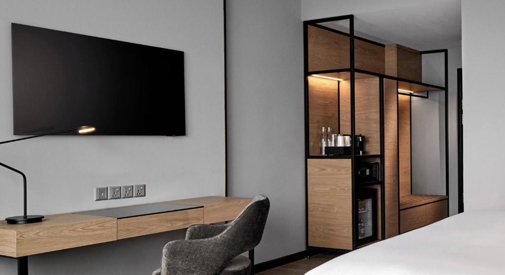 A close look at the desk, television and in-room refreshment area.