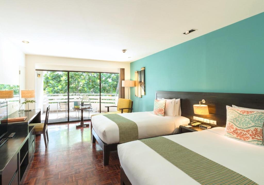 Postel nebo postele na pokoji v ubytování The Regent Cha Am Beach Resort, Hua Hin