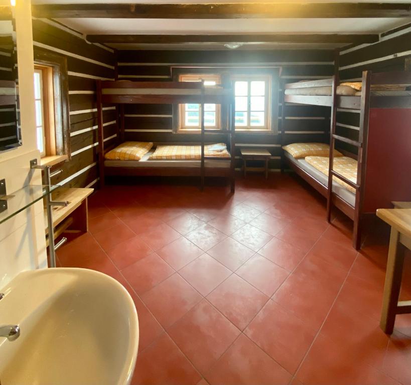 Postel nebo postele na pokoji v ubytování Bouda Klínovka