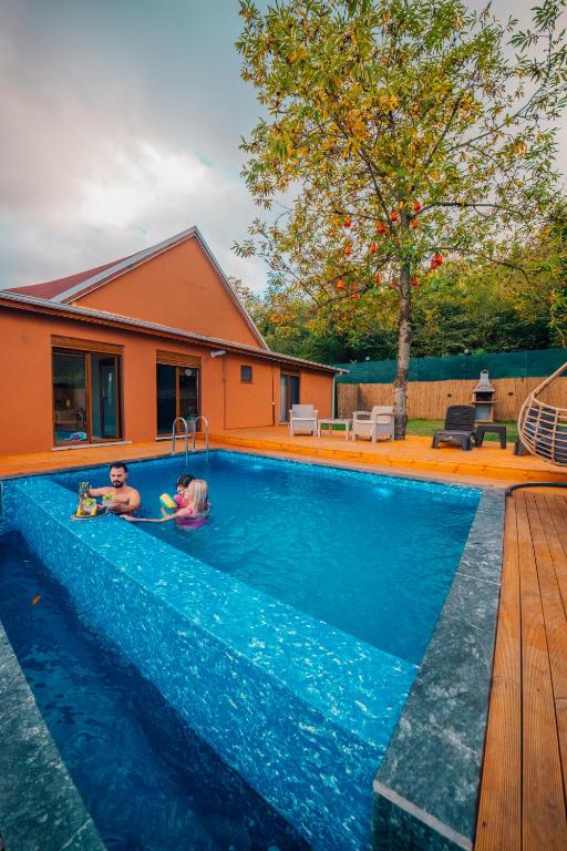 two children are playing in a swimming pool at Ginza Villa Sapanca in Sapanca