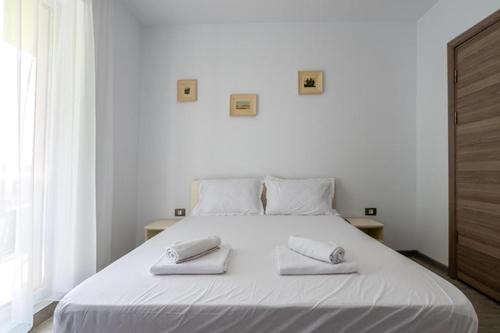 En eller flere senge i et værelse på Apartament Alexia by Alz