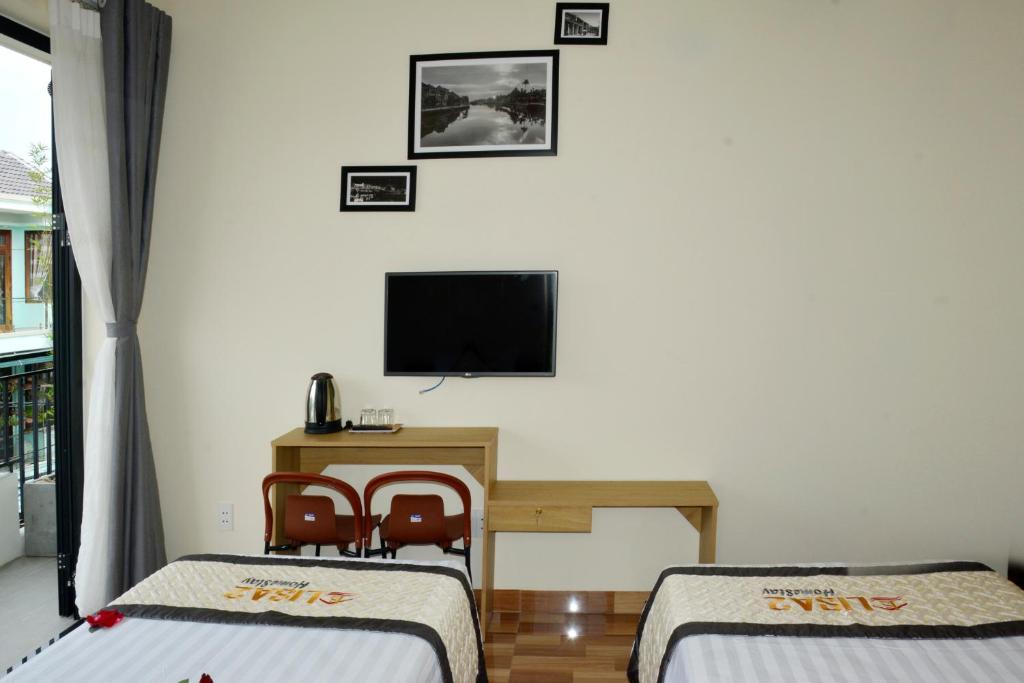TV a/nebo společenská místnost v ubytování Lisa homestay 2