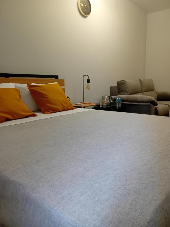 Postel nebo postele na pokoji v ubytování Hostal Lavela