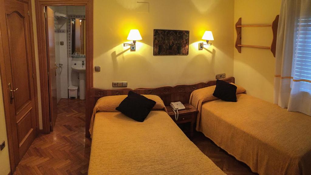 Postel nebo postele na pokoji v ubytování Hotel A Nieu