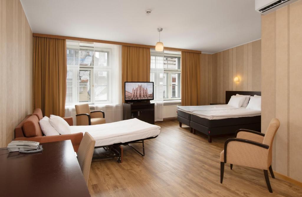 Postel nebo postele na pokoji v ubytování Hestia Hotel Barons Old Town
