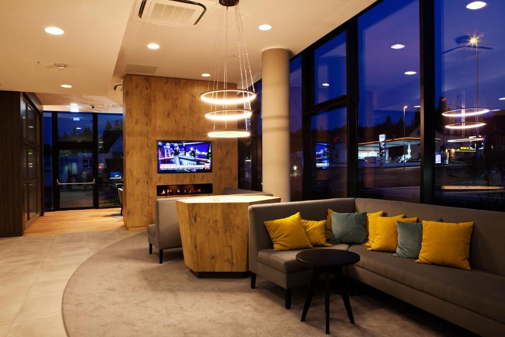 TV a/nebo společenská místnost v ubytování Hampton By Hilton Aachen Tivoli