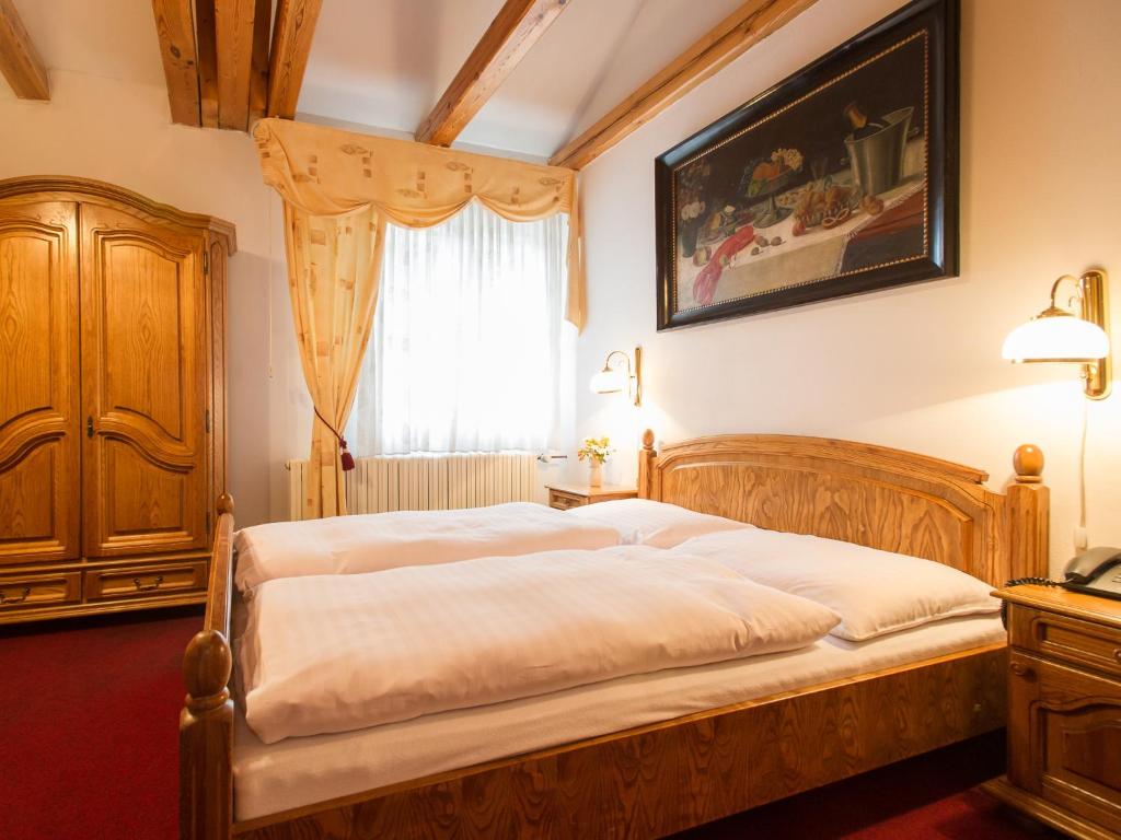 Postel nebo postele na pokoji v ubytování Hotel Šumava