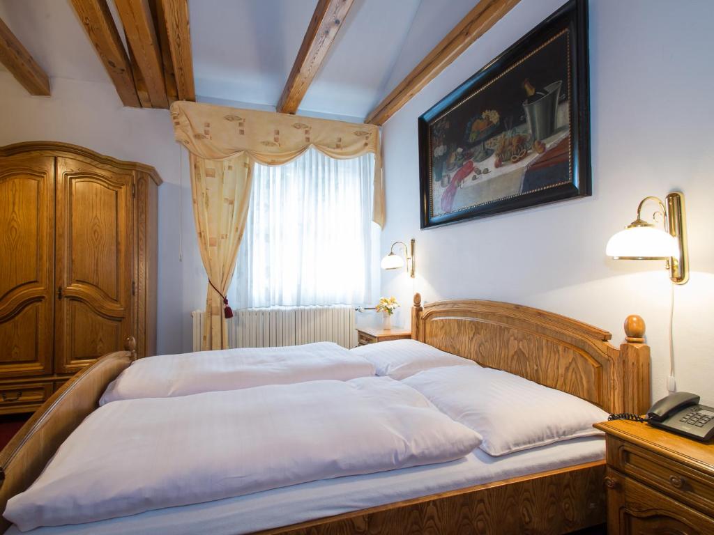 Postel nebo postele na pokoji v ubytování Hotel Šumava