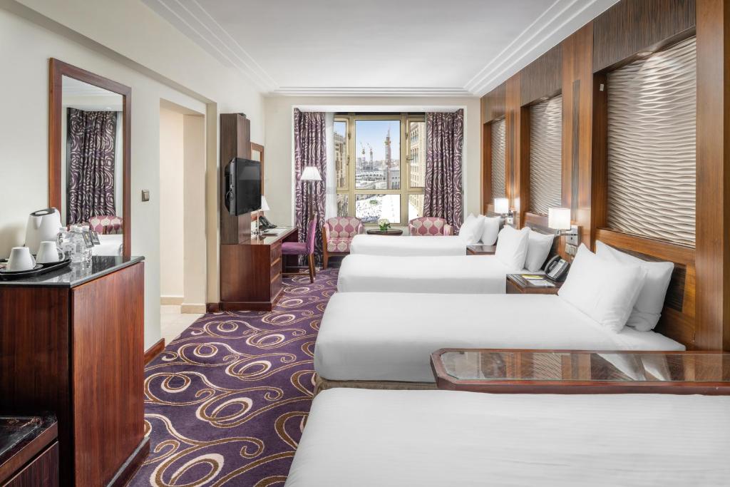Postel nebo postele na pokoji v ubytování Elaf Kinda Hotel