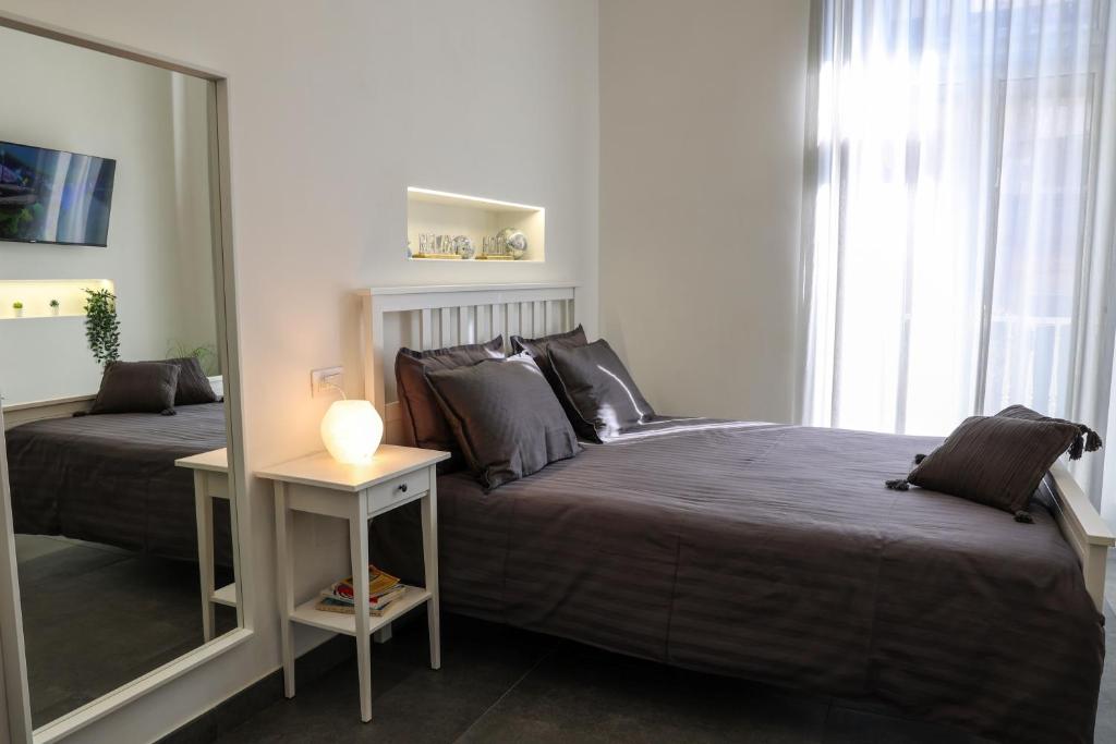 Postel nebo postele na pokoji v ubytování Bella 'Mbriana Home