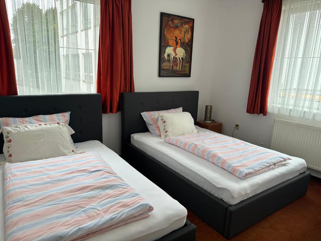 Postel nebo postele na pokoji v ubytování Penzión TATRA INN
