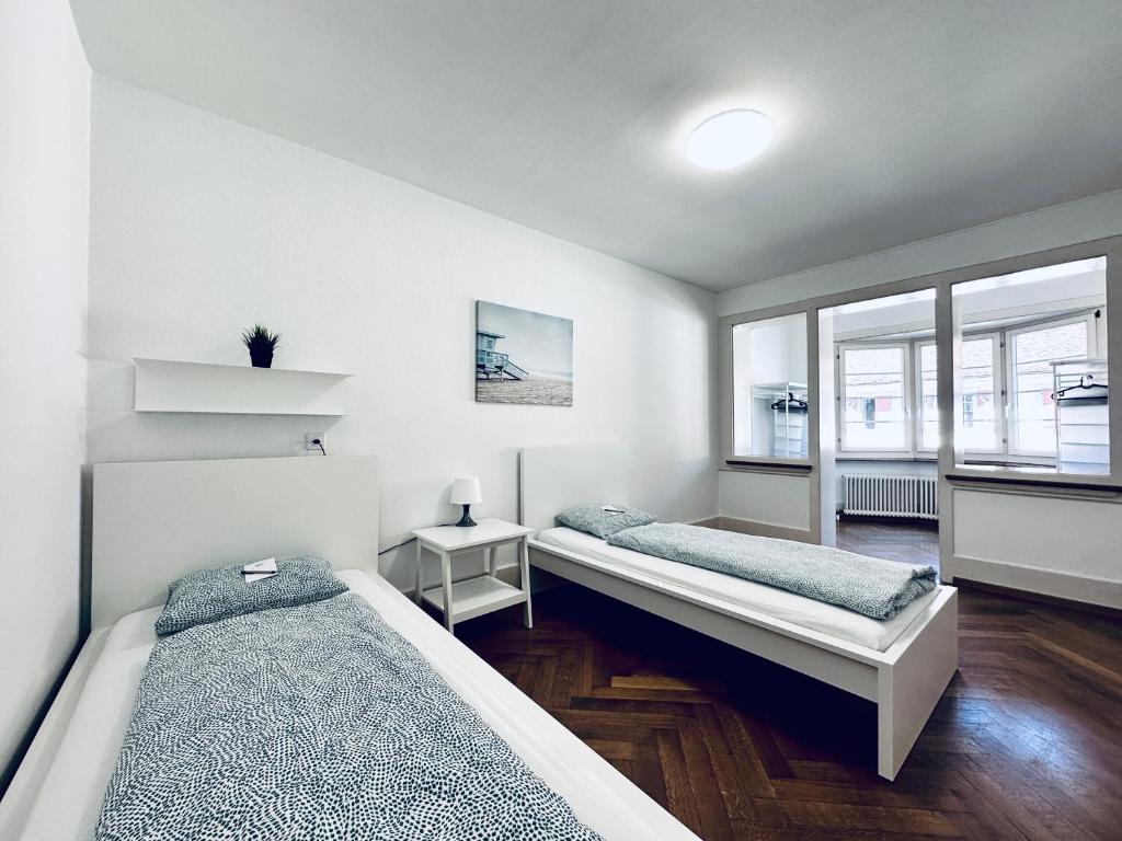 Postel nebo postele na pokoji v ubytování Monteurzimmer - Worker's accommodation - ZIMMERzuVERMIETEN in Balsthal Solothurn
