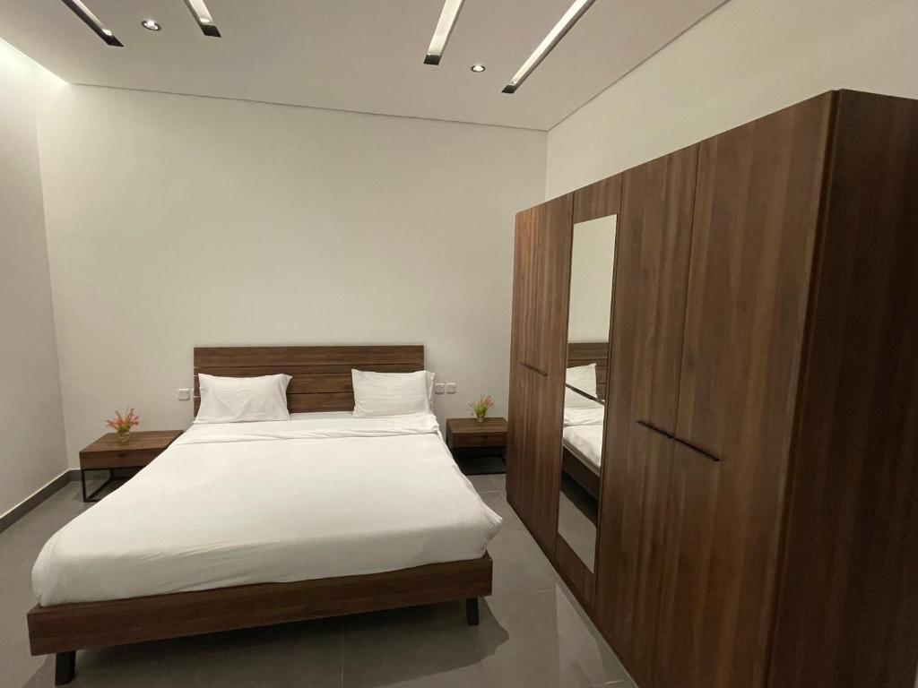 Postel nebo postele na pokoji v ubytování LADAN APARTMENT