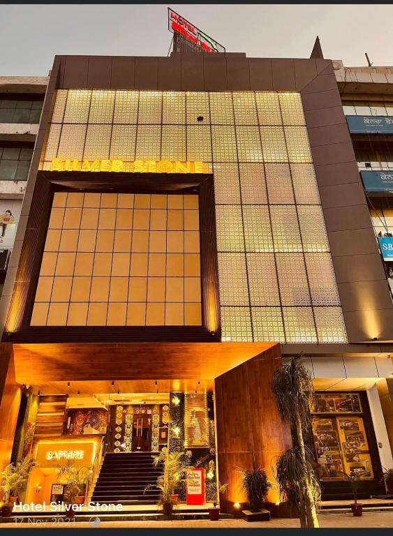 a building with a large window on the front of it at HOTEL SILVER STONE in Ludhiana