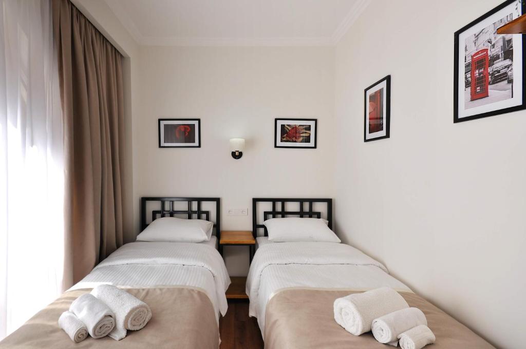 Postel nebo postele na pokoji v ubytování Hotel Art Nikola Rooms