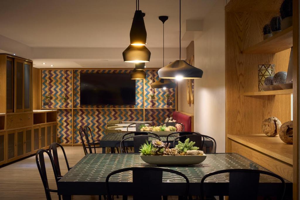 a dining room with a table with a bowl of food on it at Catalonia Born in Barcelona