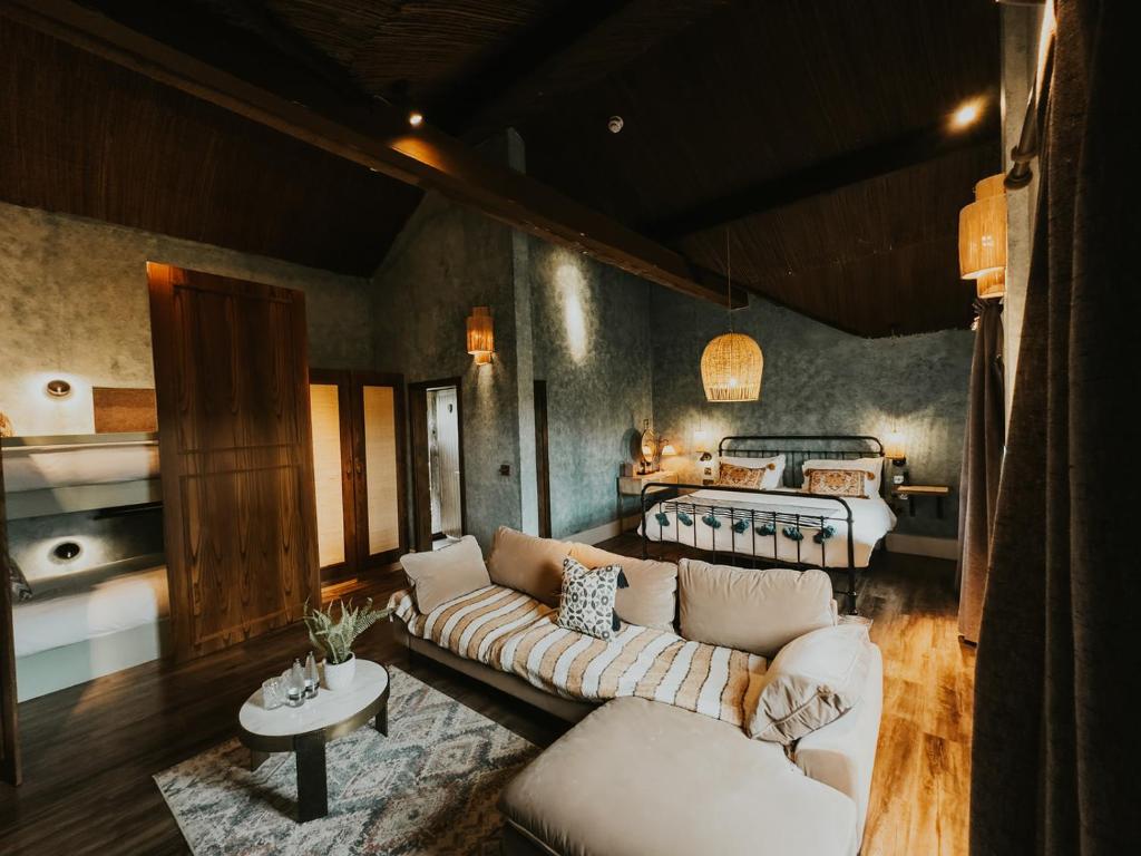 a living room with a couch and a bed at Runa Farm in Barnard Castle