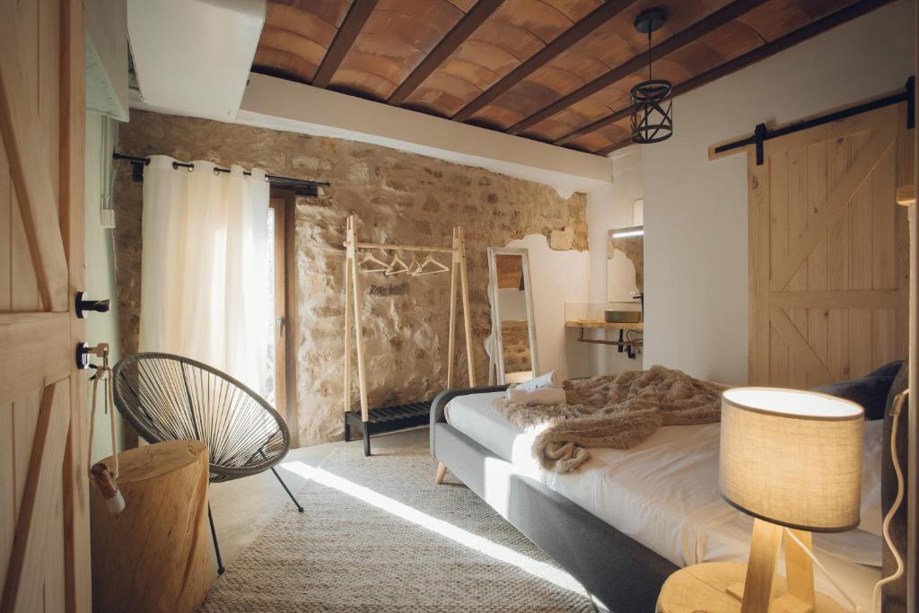 Postel nebo postele na pokoji v ubytování Castell de l'Aguda