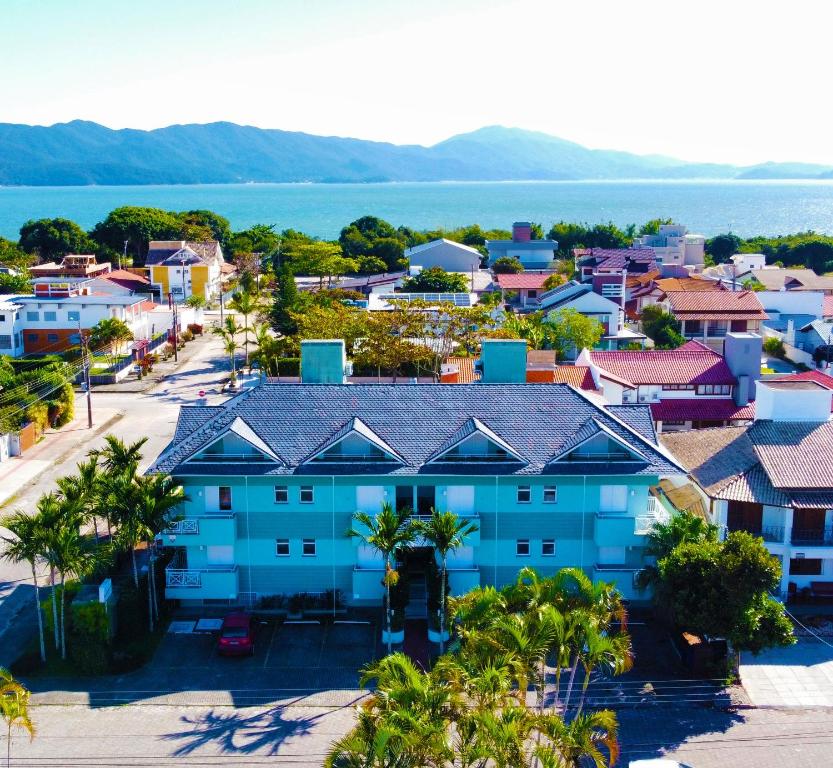 an aerial view of a town with a blue building at Belle Arti Pousada in Florianópolis