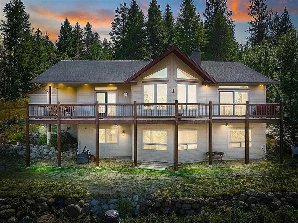 a large house with a large deck on top of it at Cozy Home w/ Views from Heaven! in Spokane