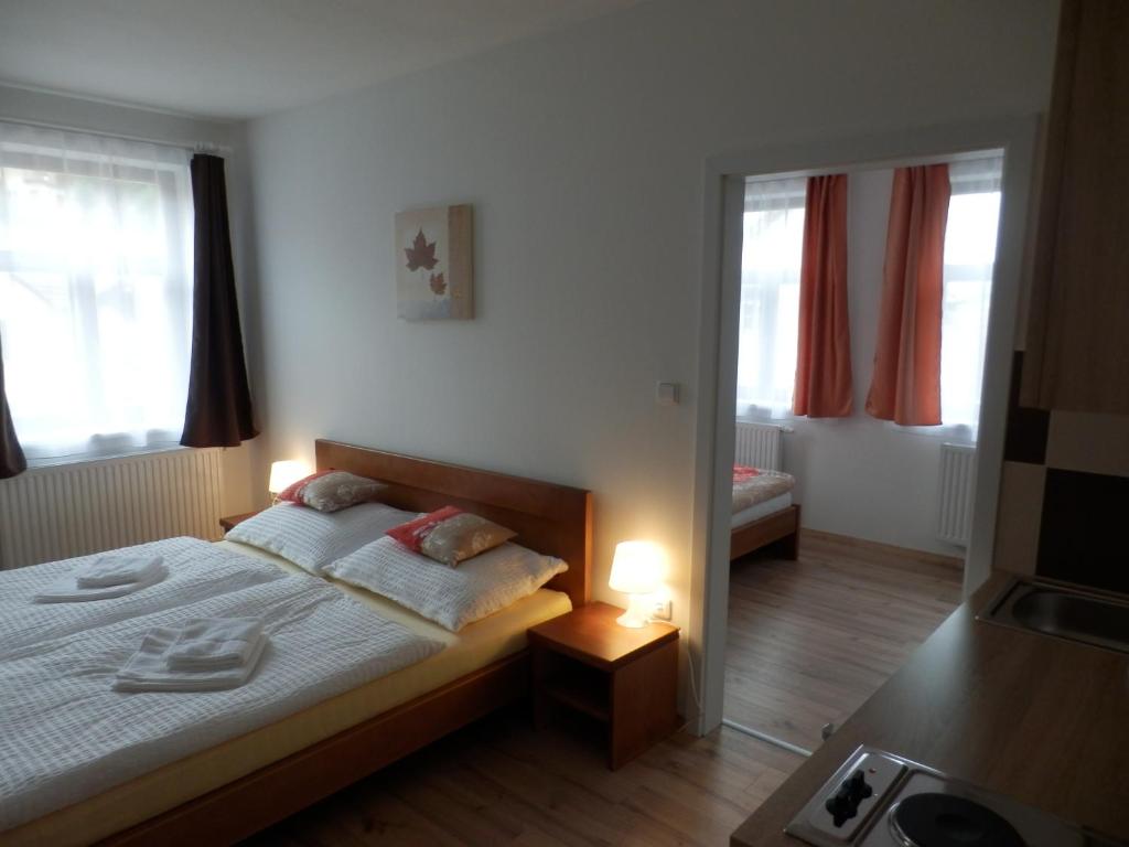 Postel nebo postele na pokoji v ubytování Dueta Apartment