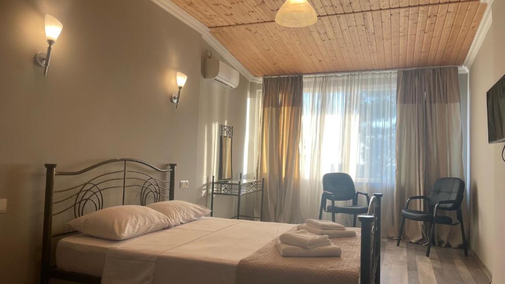 Postel nebo postele na pokoji v ubytování Argo Hotel