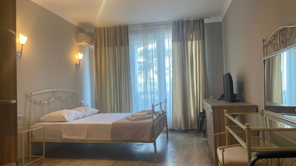 Postel nebo postele na pokoji v ubytování Argo Hotel