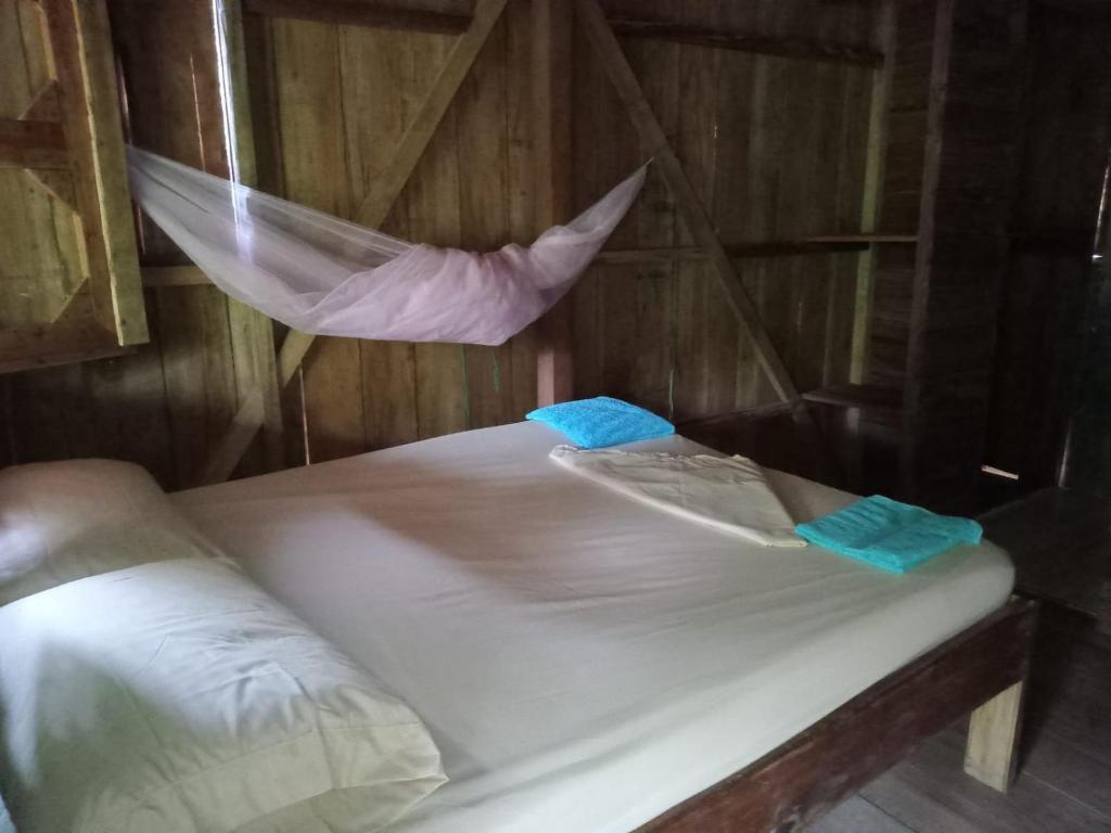 Postel nebo postele na pokoji v ubytování HOSPEDAJE DOÑA NEL