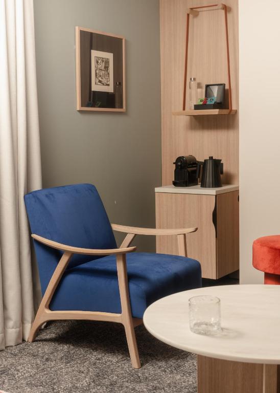 Posezení v ubytování Hôtel Parc du Landreau