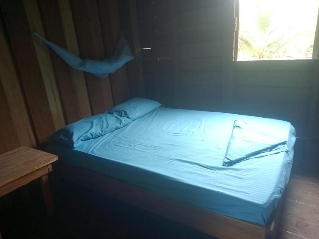 Postel nebo postele na pokoji v ubytování HOSPEDAJE DOÑA NEL