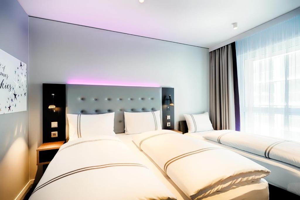 Postel nebo postele na pokoji v ubytování Premier Inn Nürnberg City Nordost