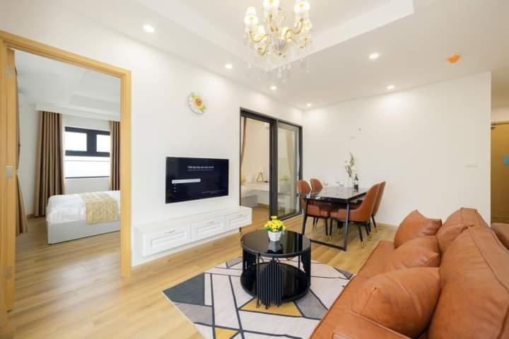 a living room with a couch and a dining room at TMS Apartment View Biển Luxury Quy Nhơn in Quy Nhon