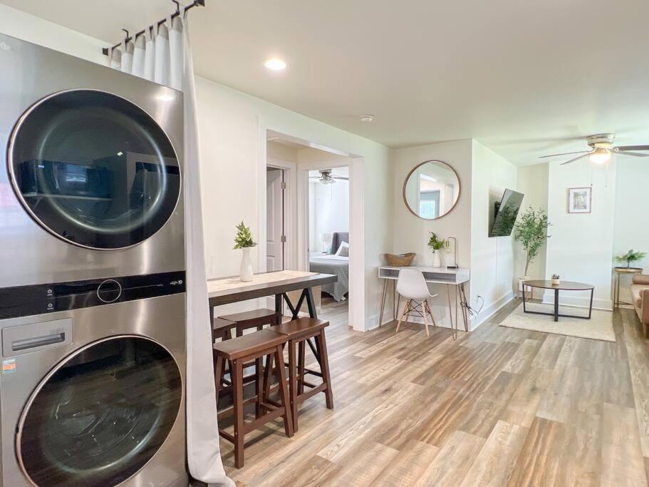 a kitchen and living room with a large washing machine at 401 Cedar Lane Rd in Greenville