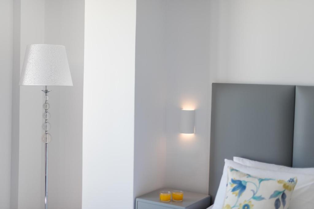 Postel nebo postele na pokoji v ubytování MAR n MAR CROWN HOTEL-SUITES