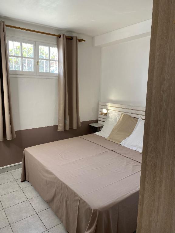 Postel nebo postele na pokoji v ubytování La Villa Davy