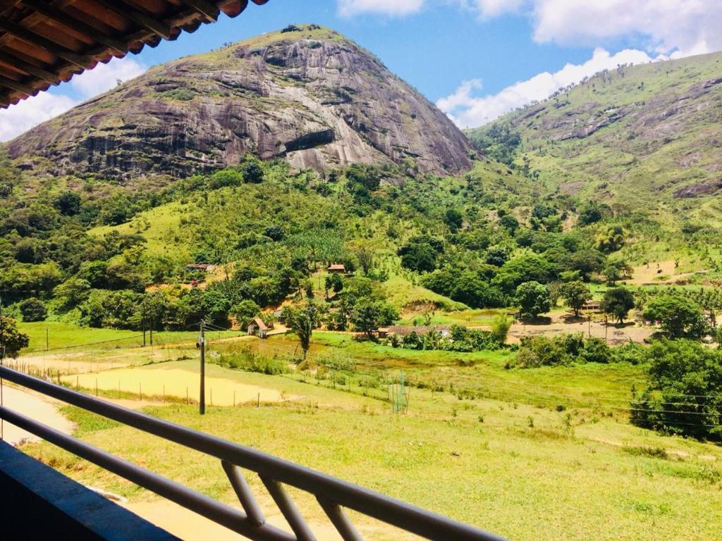 a view of a mountain from a train window at Apt Flat 210 Condomínio Pedra do Rodeadouro in Bonito