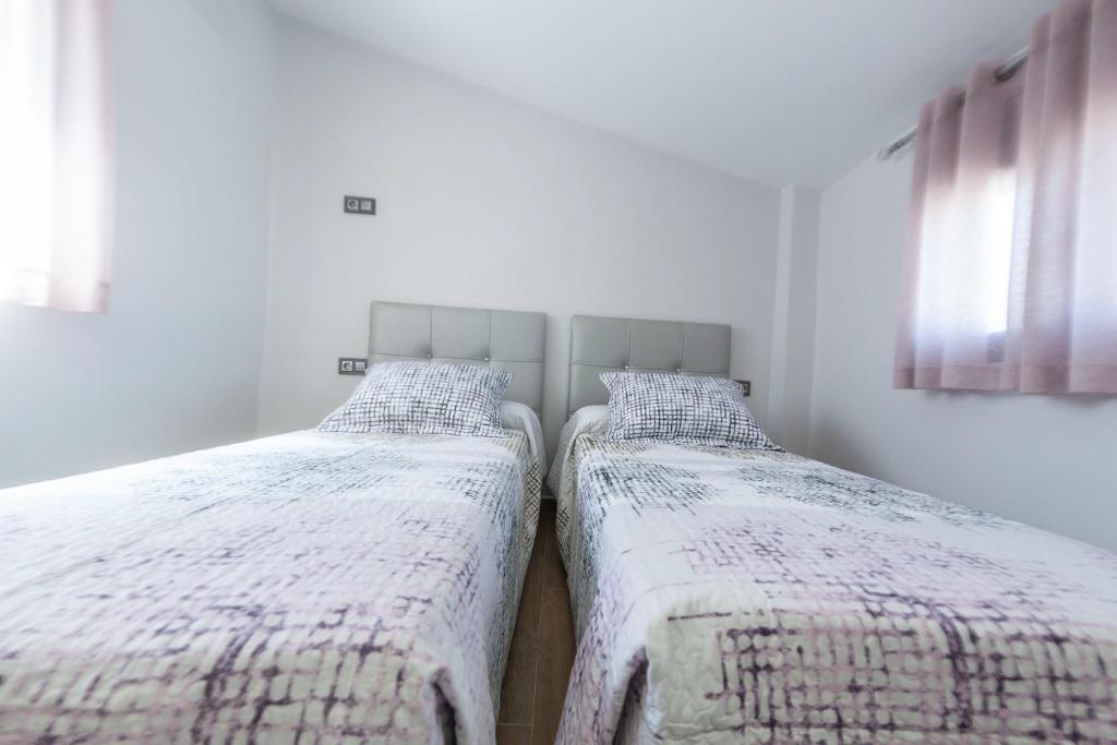 Postel nebo postele na pokoji v ubytování VTAR Puerta Del Sol