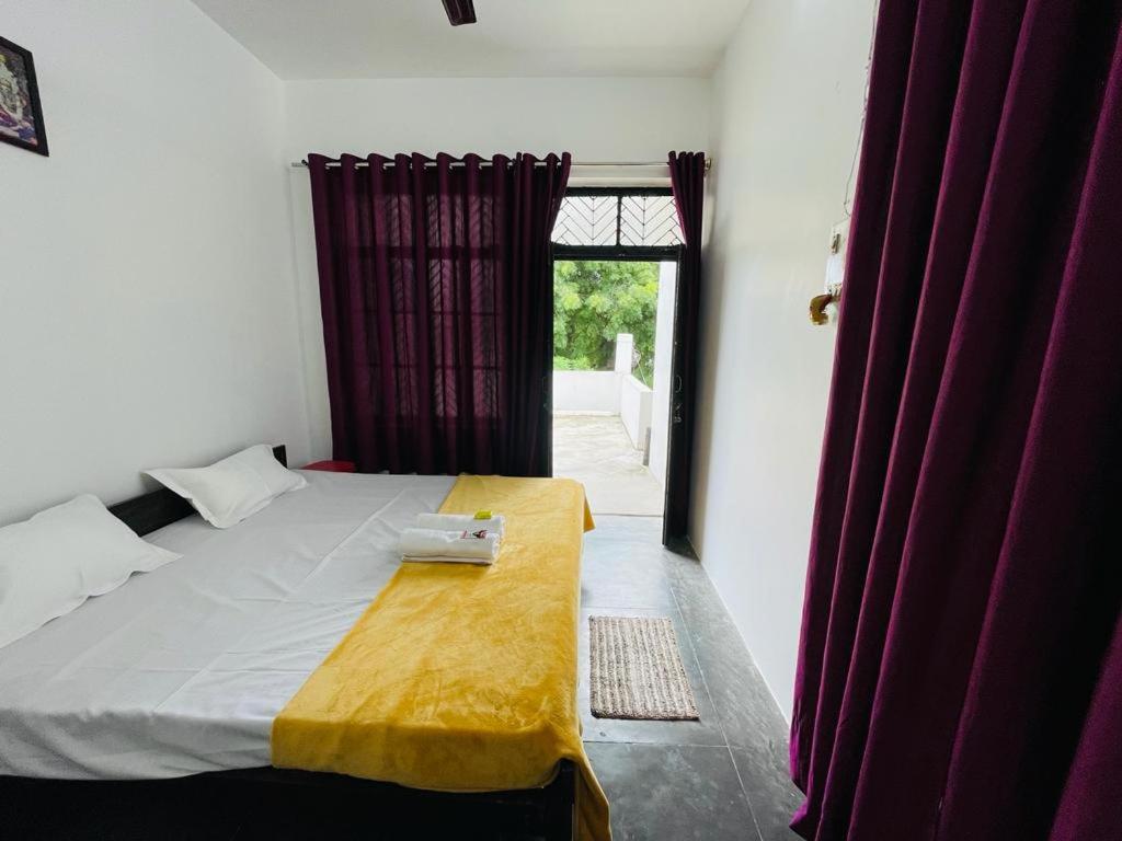 Postel nebo postele na pokoji v ubytování Shree Balaji Homestay
