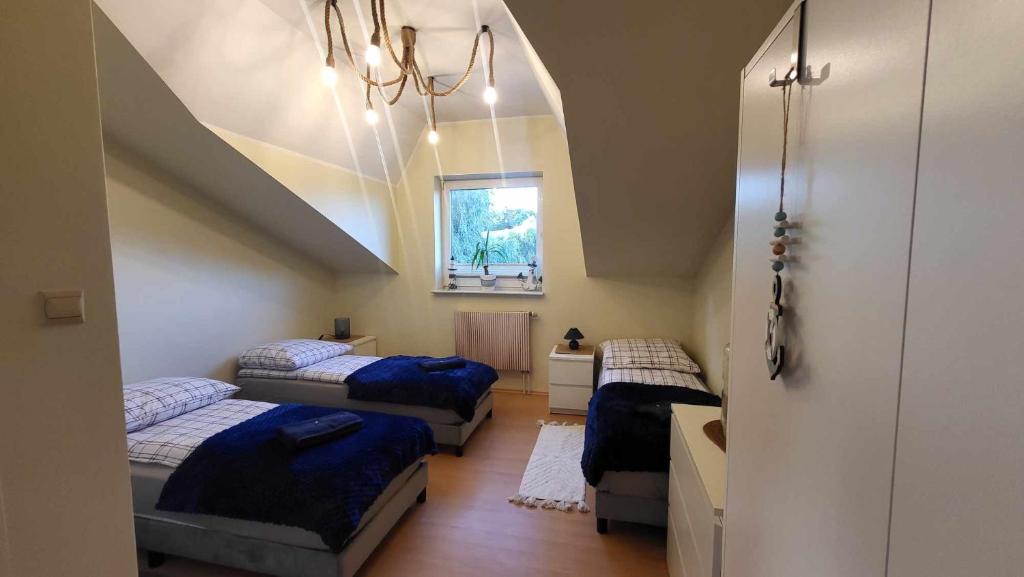 Säng eller sängar i ett rum på Apartament Mewa Gdańsk