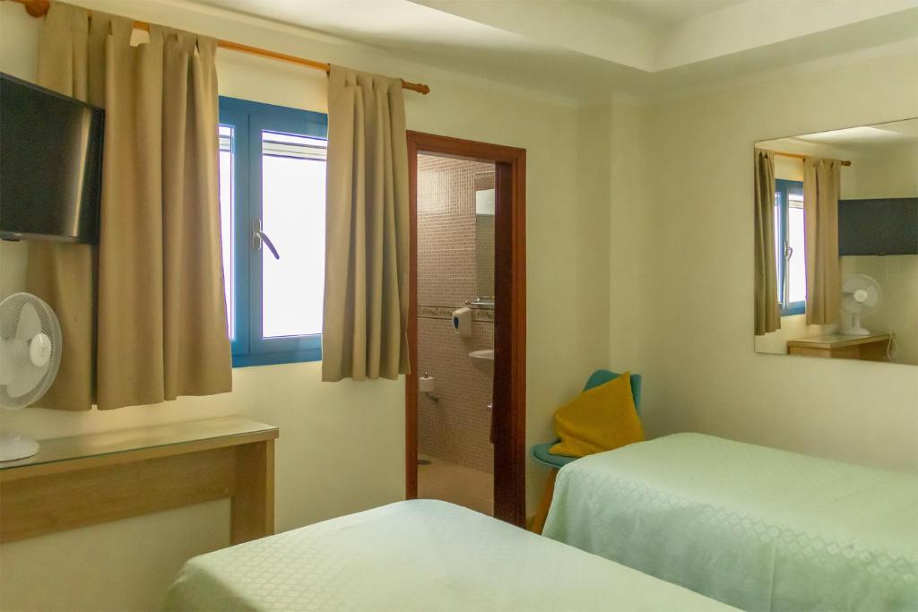 Postel nebo postele na pokoji v ubytování Hostal Magec
