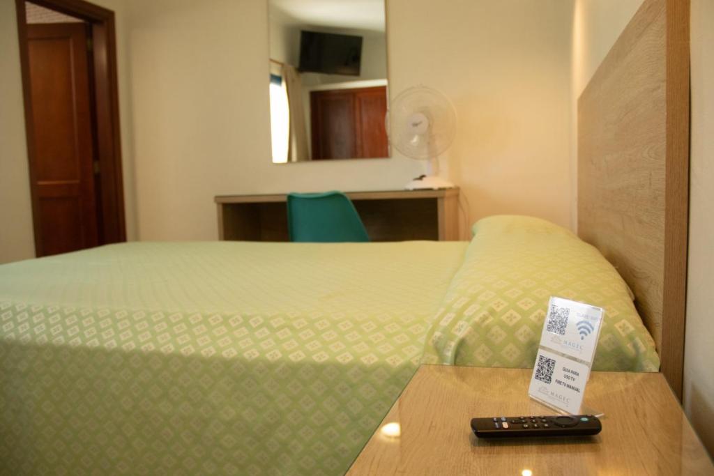 Postel nebo postele na pokoji v ubytování Hostal Magec