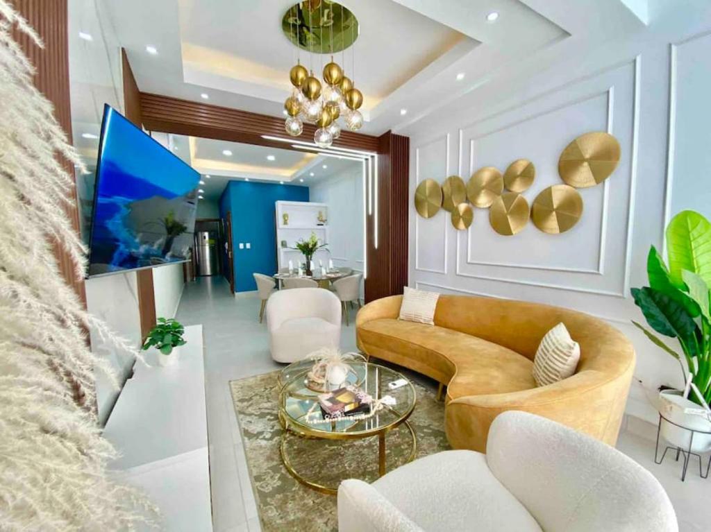 a living room with a couch and a table at Elegant City Center Condo in Santo Domingo