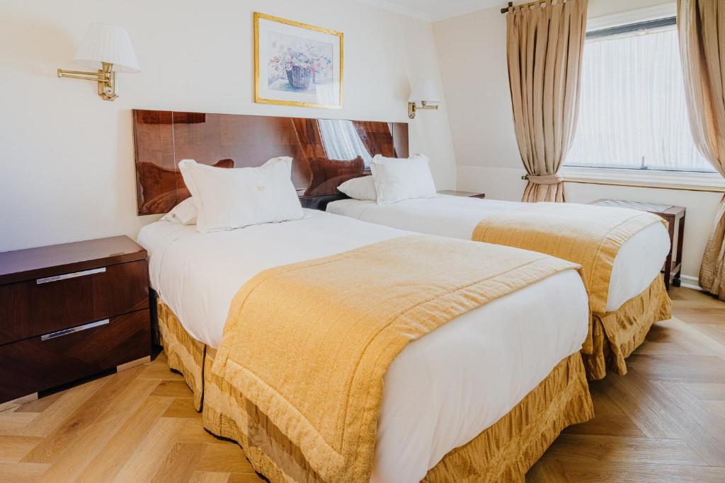 Postel nebo postele na pokoji v ubytování Orly Suites