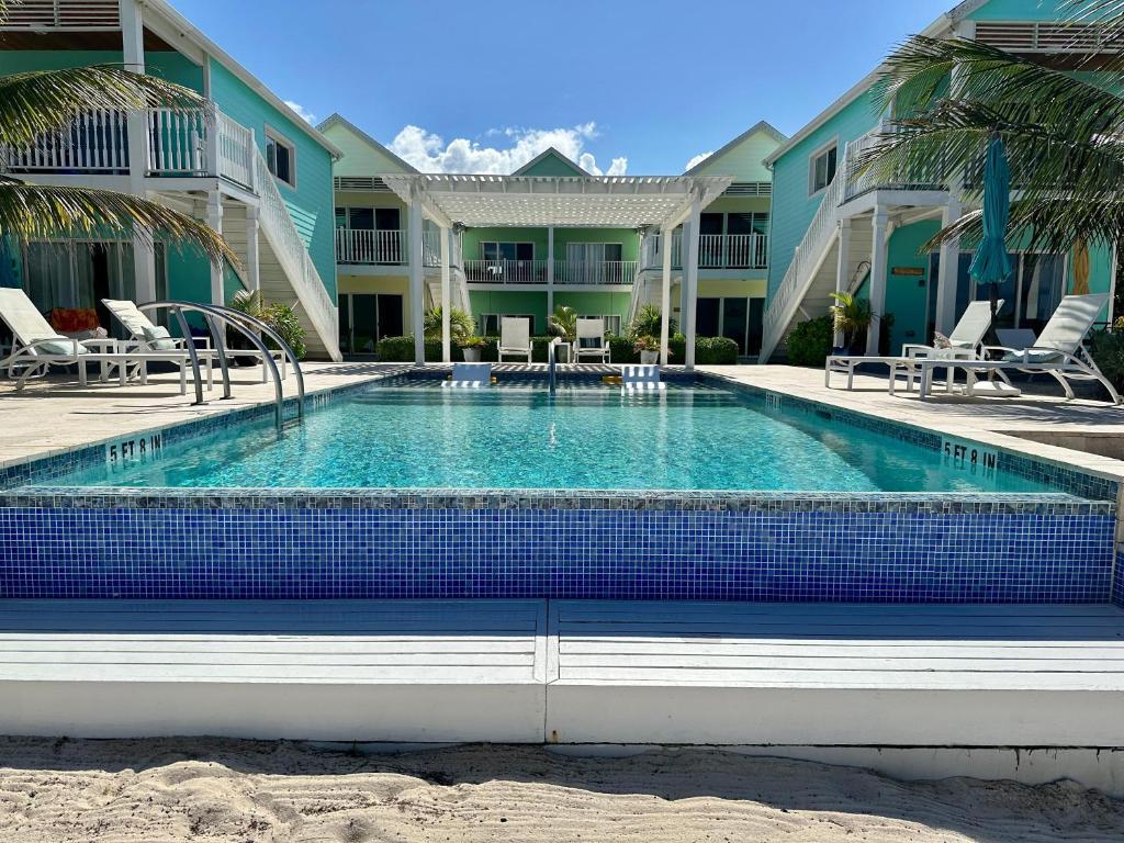 a swimming pool in front of a building at The Turtle Nest at Cottages in Sand Bluff